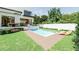Relaxing backyard features a swimming pool, sundeck, and outdoor seating at 4103 W Knights Ave, Tampa, FL 33611