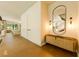 Welcoming foyer with stylish mirror, console table, and hardwood floors at 4103 W Knights Ave, Tampa, FL 33611