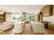 Modern open kitchen with stainless steel appliances, marble island and luxury finishes at 4103 W Knights Ave, Tampa, FL 33611
