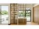 Bright, modern kitchen featuring a sink, cabinetry, and a view of the pool at 4103 W Knights Ave, Tampa, FL 33611
