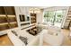 Stylish living room with a fireplace, large window, and chic furnishings at 4103 W Knights Ave, Tampa, FL 33611
