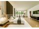 Spacious main bedroom with a large bed, modern lighting, and serene decor at 4103 W Knights Ave, Tampa, FL 33611