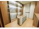 Beautiful walk-in closet with custom shelving and modern display island, offering ample storage at 4103 W Knights Ave, Tampa, FL 33611