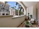 Serene balcony space with elegant outdoor seating and views of tropical palm trees, enhancing outdoor living at 450 Knights Run Ave # 104, Tampa, FL 33602