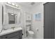 Cozy half-bathroom with modern fixtures, cabinet storage, and stylish vanity at 450 Knights Run Ave # 104, Tampa, FL 33602