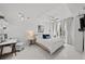 Inviting bedroom with a comfortable bed, desk area, and balcony access through sheer curtains at 450 Knights Run Ave # 104, Tampa, FL 33602