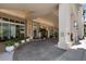 A well-maintained entrance with potted plants, leading to an upscale building entrance at 450 Knights Run Ave # 104, Tampa, FL 33602