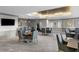 Stylish community room with comfortable seating areas, a wet bar, and a large-screen television for resident's enjoyment at 450 Knights Run Ave # 104, Tampa, FL 33602