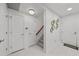 Hallway entrance with three interior doors and staircase at 450 Knights Run Ave # 104, Tampa, FL 33602
