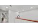 Clean hallway with modern track lighting, leading to bright rooms with neutral walls and modern decor at 450 Knights Run Ave # 104, Tampa, FL 33602