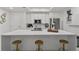 Bright kitchen featuring a large quartz island with seating, stainless steel appliances, and modern finishes at 450 Knights Run Ave # 104, Tampa, FL 33602