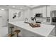 Bright and modern kitchen with quartz countertops, stainless steel appliances, and sleek cabinetry at 450 Knights Run Ave # 104, Tampa, FL 33602