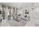 Bright living room with stylish furniture, modern lighting, and elegant curtains at 450 Knights Run Ave # 104, Tampa, FL 33602