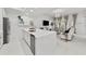 Open-concept living space with a kitchen island and a cozy sitting area with natural light at 450 Knights Run Ave # 104, Tampa, FL 33602