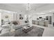 Spacious living room showcases modern decor, white seating, and a sleek marble coffee table at 450 Knights Run Ave # 104, Tampa, FL 33602