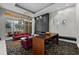 Modern lobby featuring a black fireplace, large window and elegant décor creating a stylish space at 450 Knights Run Ave # 104, Tampa, FL 33602