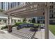 An outdoor patio with comfortable seating, manicured landscaping and an inviting atmosphere at 450 Knights Run Ave # 104, Tampa, FL 33602