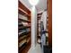 Organized walk-in closet with custom wood shelving for ample storage and organization solutions at 450 Knights Run Ave # 104, Tampa, FL 33602