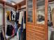 Beautiful custom walk-in closet featuring built-in shelving, drawers, and hanging racks for clothing storage at 450 Knights Run Ave # 104, Tampa, FL 33602