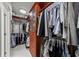 Bright walk-in closet with custom shelving, drawers, hanging rods, and plenty of organized storage space at 450 Knights Run Ave # 104, Tampa, FL 33602