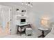 Dedicated workspace with shelves and contemporary desk at 450 Knights Run Ave # 104, Tampa, FL 33602