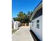 Exterior view of backyard with concrete driveway and fencing at 4511 Hampshire Rd, Tampa, FL 33634