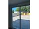 View of backyard and fence from sliding glass doors at 4511 Hampshire Rd, Tampa, FL 33634
