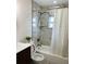 Bathroom featuring a modern vanity and a stylish shower with marbled tiles at 4511 Hampshire Rd, Tampa, FL 33634