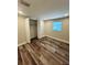Bedroom with new hard wood floors, new paint and double door closet at 4511 Hampshire Rd, Tampa, FL 33634