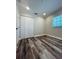 A bedroom with hardwood floors and a closet with folding doors and a window at 4511 Hampshire Rd, Tampa, FL 33634