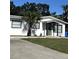 Exterior shot of well-maintained home with manicured lawn and newly mulched front yard at 4511 Hampshire Rd, Tampa, FL 33634