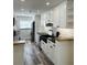A kitchen with white cabinets, stainless steel appliances, and granite countertops at 4511 Hampshire Rd, Tampa, FL 33634