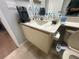 Bathroom featuring vanity sink with toiletries, toilet with bidet and neutral color palette at 4558 Morningside # 43, Sarasota, FL 34235