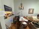 Open-concept dining room with chandelier and easy access to both living room and kitchen at 4558 Morningside # 43, Sarasota, FL 34235