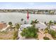Beautiful waterfront property features a private dock, lush landscaping, and stunning water views at 464 20Th Ave, Indian Rocks Beach, FL 33785