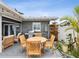 Backyard with a grill, an outdoor dining set, outdoor seating, and beautiful landscaping at 464 20Th Ave, Indian Rocks Beach, FL 33785