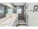 Modern bathroom with glass shower, tiled walls, and double sink vanity at 464 20Th Ave, Indian Rocks Beach, FL 33785