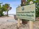 Inviting 21st Avenue Beach Access Park sign at Indian Rocks Beach with trees and beach view at 464 20Th Ave, Indian Rocks Beach, FL 33785