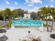 Welcome to Indian Rocks Beach sign with swaying palms and Villa Gallace Italian Cuisine nearby at 464 20Th Ave, Indian Rocks Beach, FL 33785