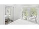 Bright bedroom with a large window providing natural light, and a mirrored closet enhancing space at 464 20Th Ave, Indian Rocks Beach, FL 33785