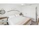Bedroom featuring a white bed, ceiling fan, and built-in wardrobe at 464 20Th Ave, Indian Rocks Beach, FL 33785