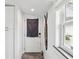 Hallway with white cabinets, wood-look flooring, and a window letting in natural light at 464 20Th Ave, Indian Rocks Beach, FL 33785