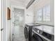 Convenient laundry room with modern washer and dryer, showcasing functionality and style at 464 20Th Ave, Indian Rocks Beach, FL 33785