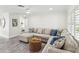 Comfortable living room featuring a large sectional sofa and wood-look flooring at 464 20Th Ave, Indian Rocks Beach, FL 33785