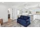 Cozy living room area with modern furnishings, open to the kitchen, and views of the Primary bedroom at 464 20Th Ave, Indian Rocks Beach, FL 33785