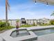 Inviting pool and patio area with waterfront views, perfect for relaxing and entertaining outdoors at 464 20Th Ave, Indian Rocks Beach, FL 33785