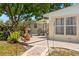 Cozy backyard featuring a patio, dining set, and grill for outdoor entertainment at 4701 W Wyoming Ave, Tampa, FL 33616