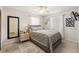 Bedroom with a gray bed, light gray walls, a carpet, and natural lighting at 4701 W Wyoming Ave, Tampa, FL 33616