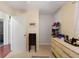 Bedroom closet with shoe rack, dresser, jewelry box, and carpet at 4701 W Wyoming Ave, Tampa, FL 33616