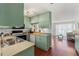 Functional kitchen design with a view of the living area, featuring classic cabinets at 4701 W Wyoming Ave, Tampa, FL 33616